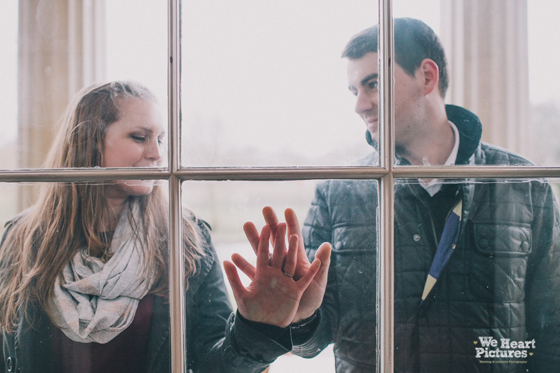 Couple behind a window, Creative Wedding Photographer London Engagement Shoot