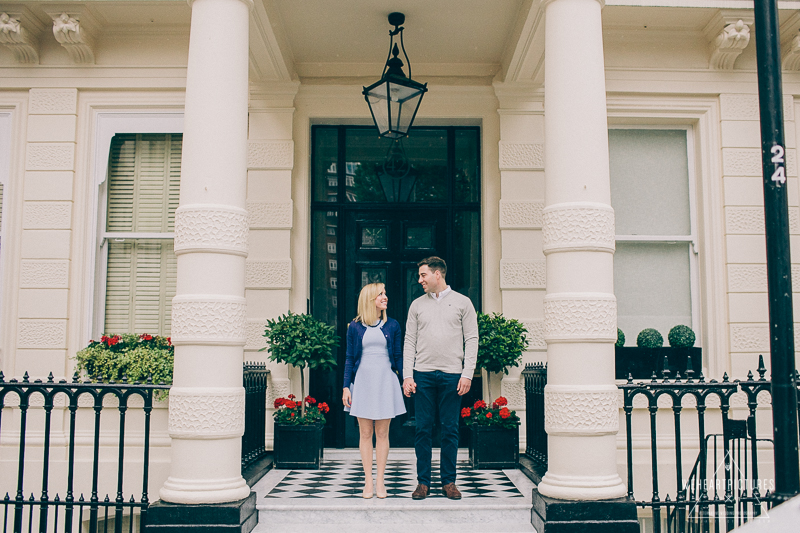 Couple Standing at the doorstep of their old flat.