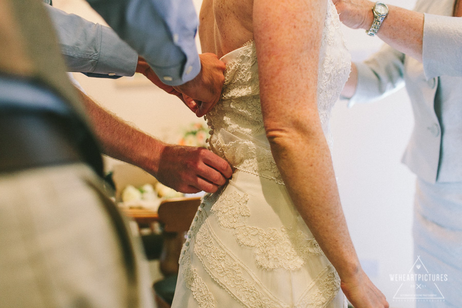 Detail of Bride getting dress and helping hands | Loch Coruisk Humanistic Wedding | Alternative Wedding Photographer | Marys Cottages Elgol