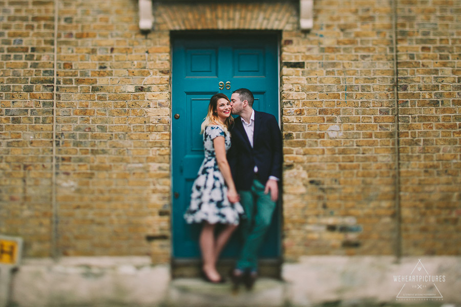 Couple kissing in front of door, Alternative Wedding Photographer, Engagement Shoot, London in the Autumn
