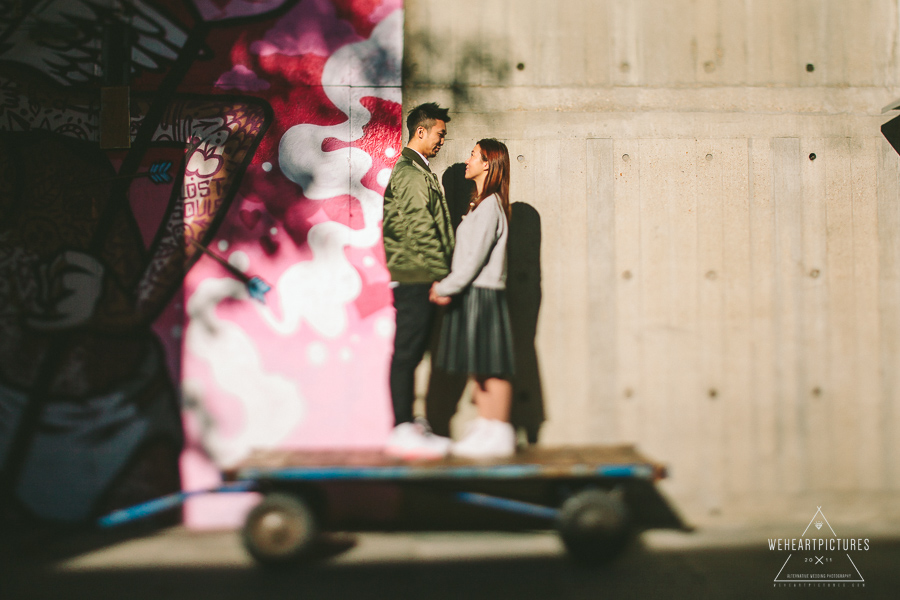 Couple standing on trolly, Alternative wedding photographer in London