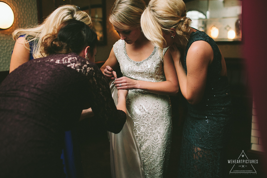 Friends helping a bride to fix her dress-Hawksmoor_Guildhall-Rosewood_Hotel-London-Wedding-Photographer-0086