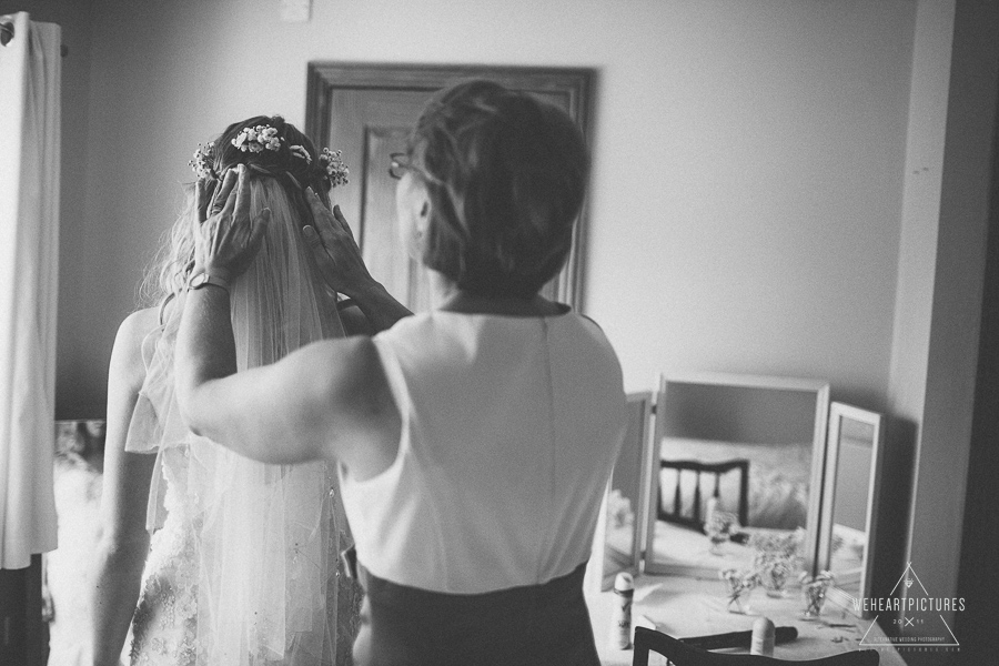 Mum arranging her daughter's hair in the morning of the wedding | Creative Wedding Photography UK & Destination >> weheartpictures.com