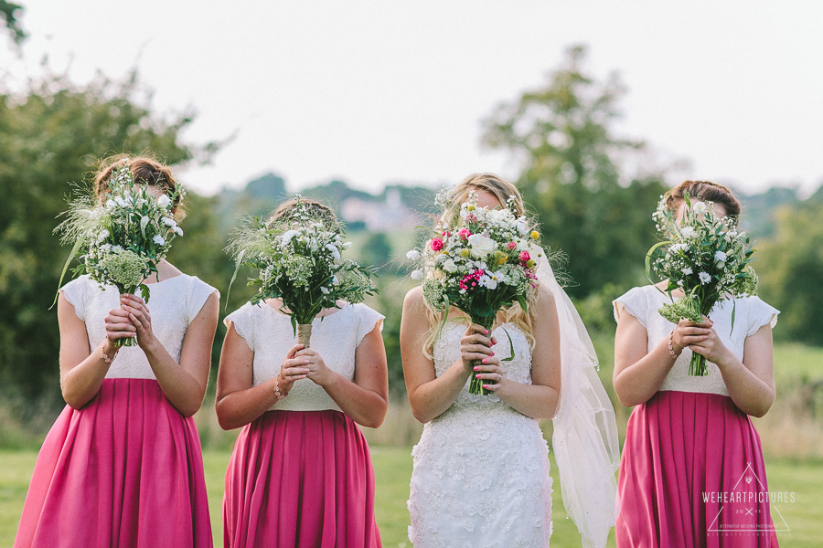 Group Pictures, Bridesmaids covering their faces with their bouquets | Creative Wedding Photography UK & Destination >> weheartpictures.com