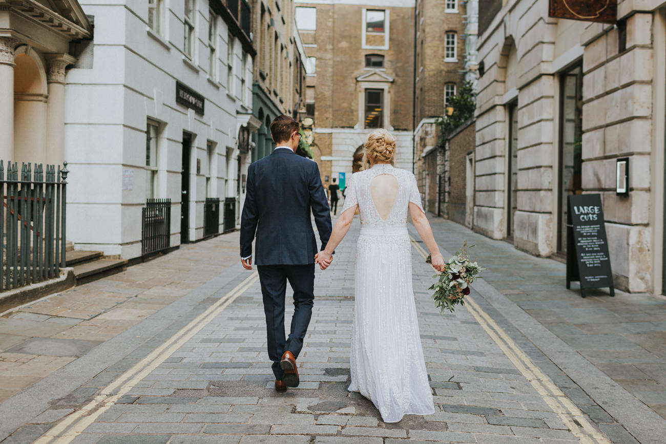 Bride and groom holding hands and walking in Liverpool Street London.
Devonshire Terrace Wedding London Alternative Wedding Photographer