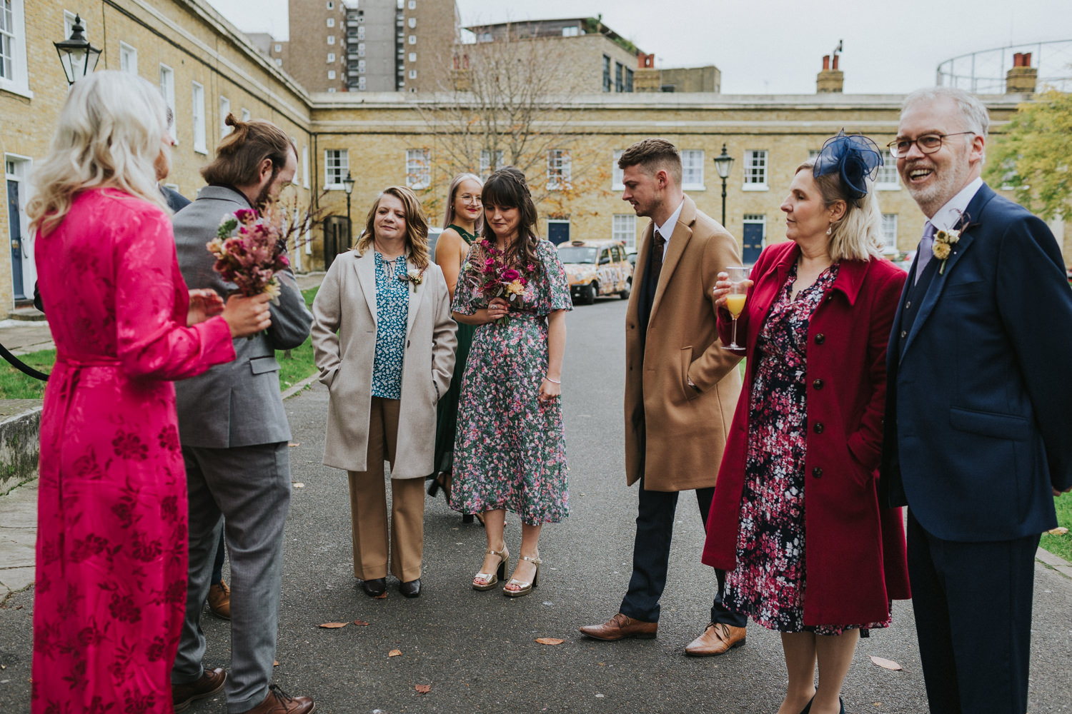 Wedding guests in colourful pattern dresses