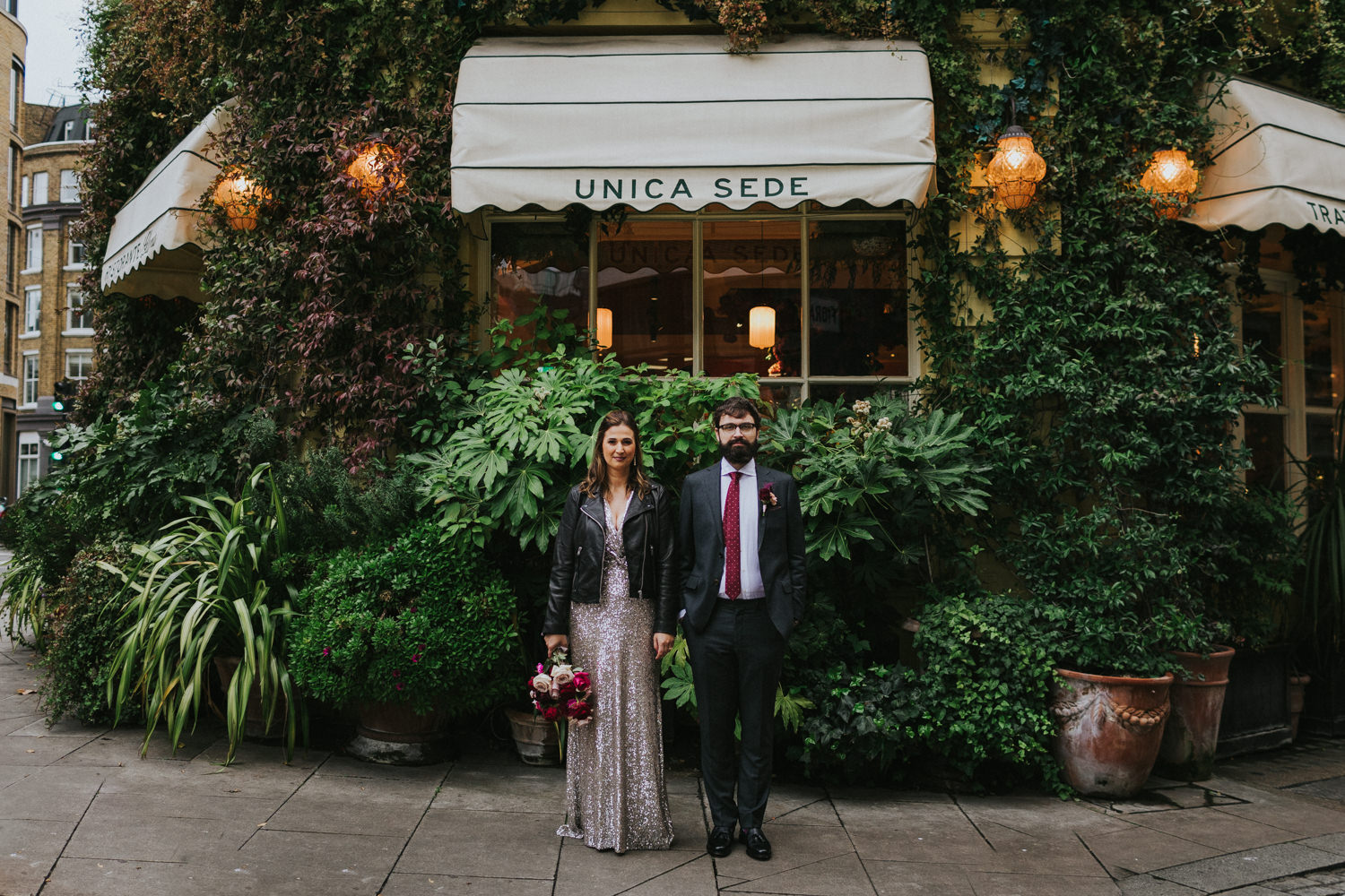 Bride and Groom in front of a restaurant in East London. Wes Anderson Style.