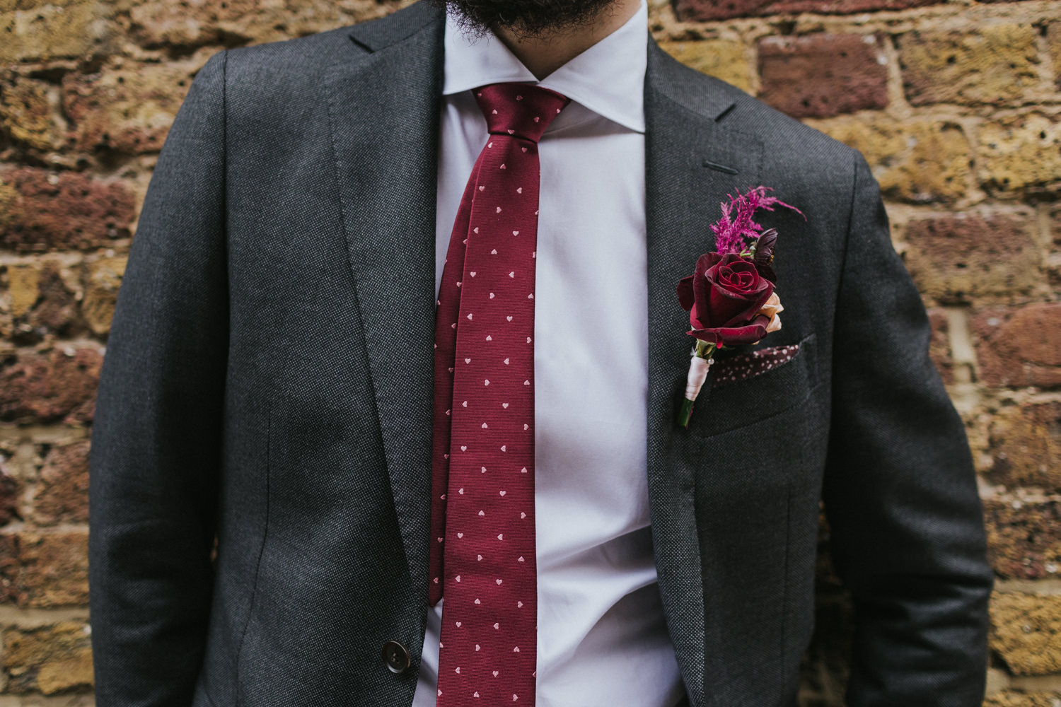 Photo of Groom flower details in the streets of east London.