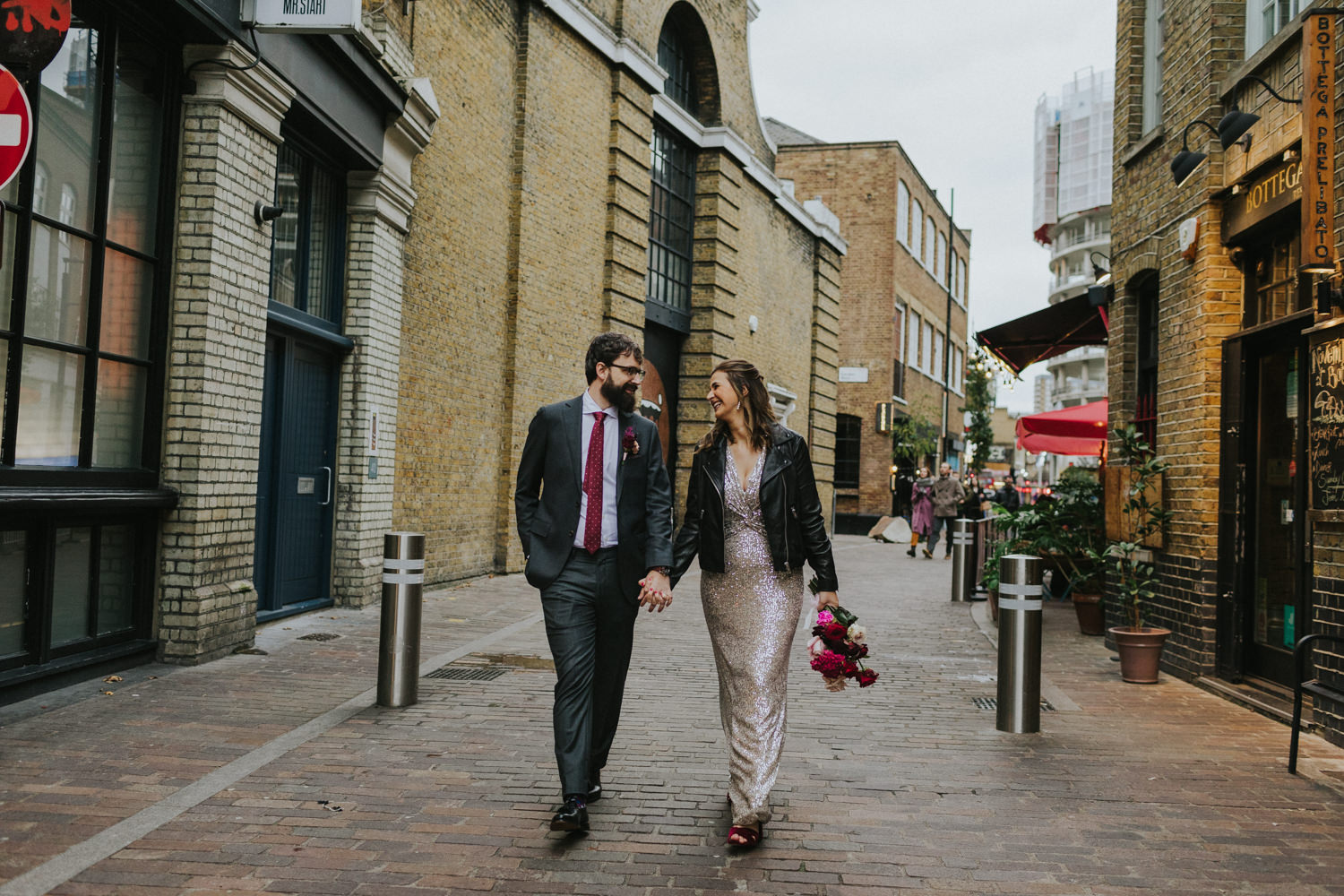 Newlyweds in the streets of London during their photoshoot.