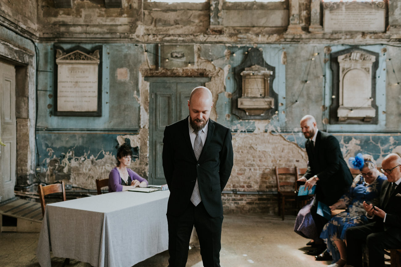 Groom Waiting for his bride - London Wedding Ceremony at Asylum Chapel in Caroline Gardens - Alternative Wedding Photography We Heart Pictures 