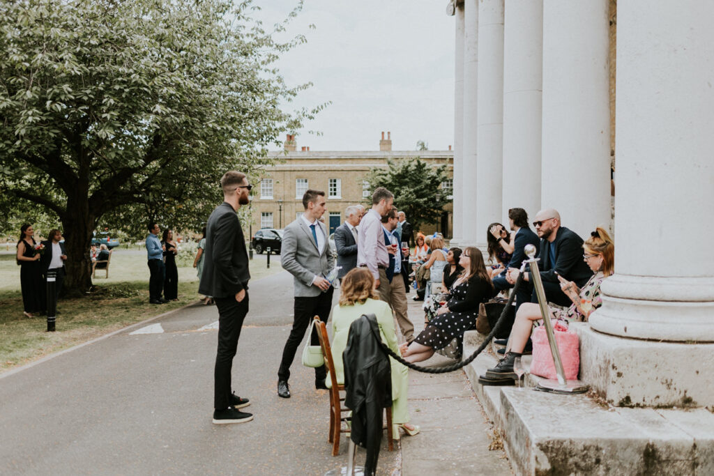 Relaxed guests at London Wedding Ceremony at Asylum Chapel in Caroline Gardens - Alternative Wedding Photography We Heart Pictures