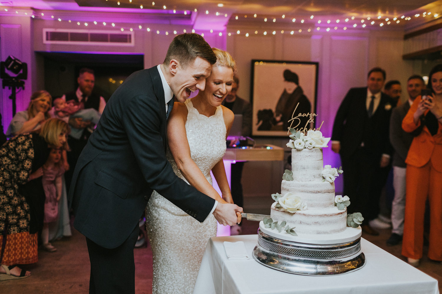 Cutting the cake, London Bingham Riverhouse Wedding Photographer, weheartpictures