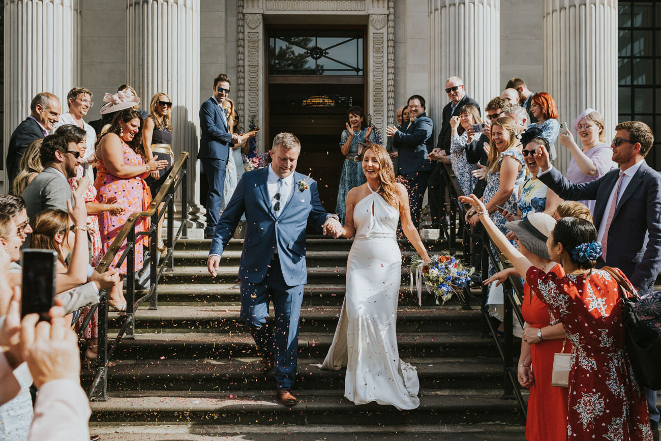 Confetti at Westminster Town Hall. London wedding at Old Marylebone Town Hall and Petersham Nurseries in Covent Garden Alternative Wedding Photographer We Heart Pictures