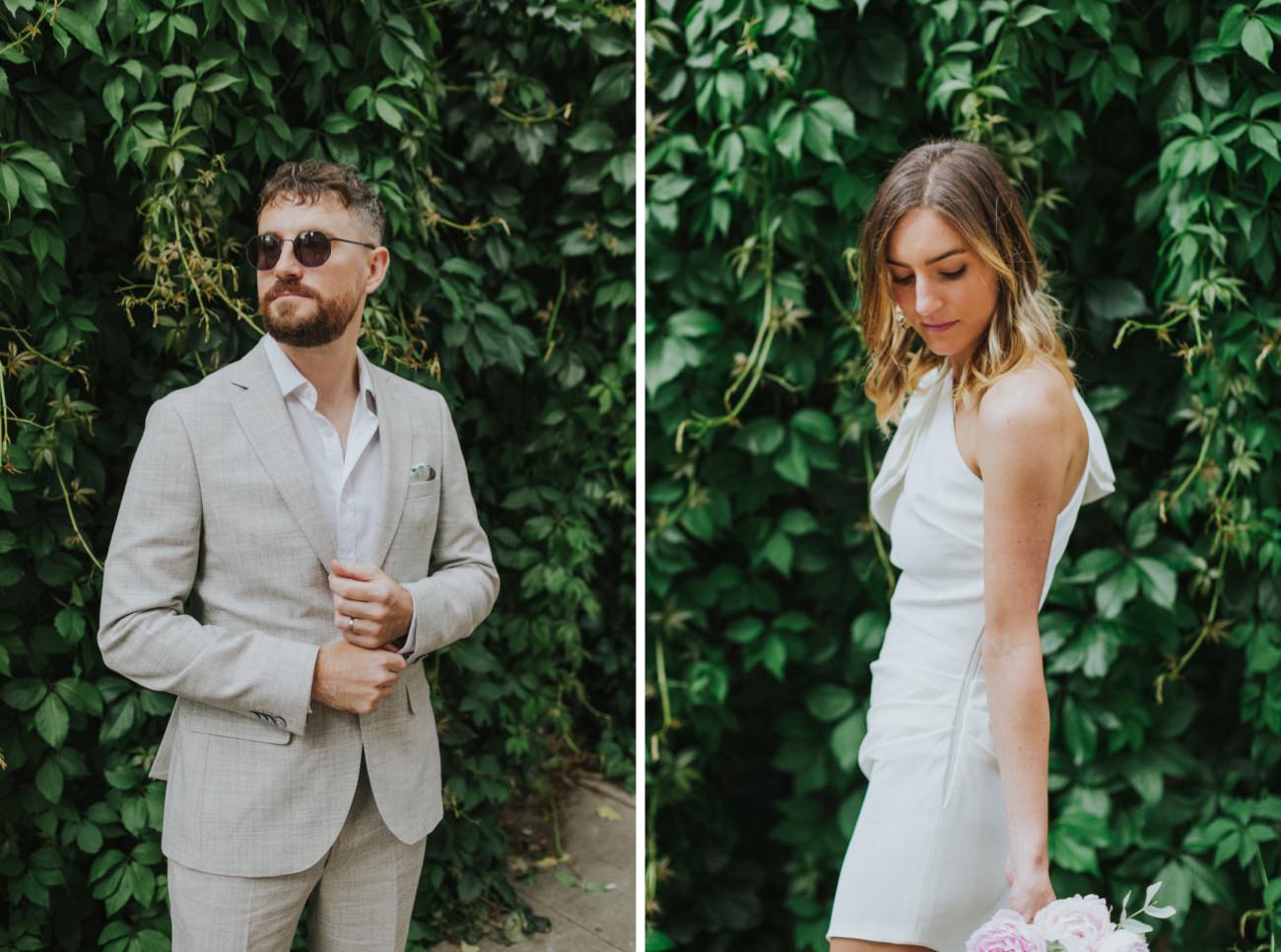 Bride and groom outfits and fashion in front of a leafy wall in London.
