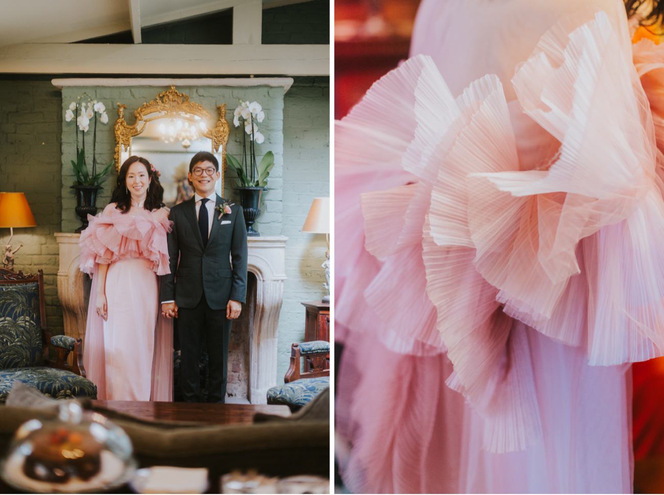 Bride wears Pink Froufrou dress with layers. The couple stand infant of fireplace in wedding outfits