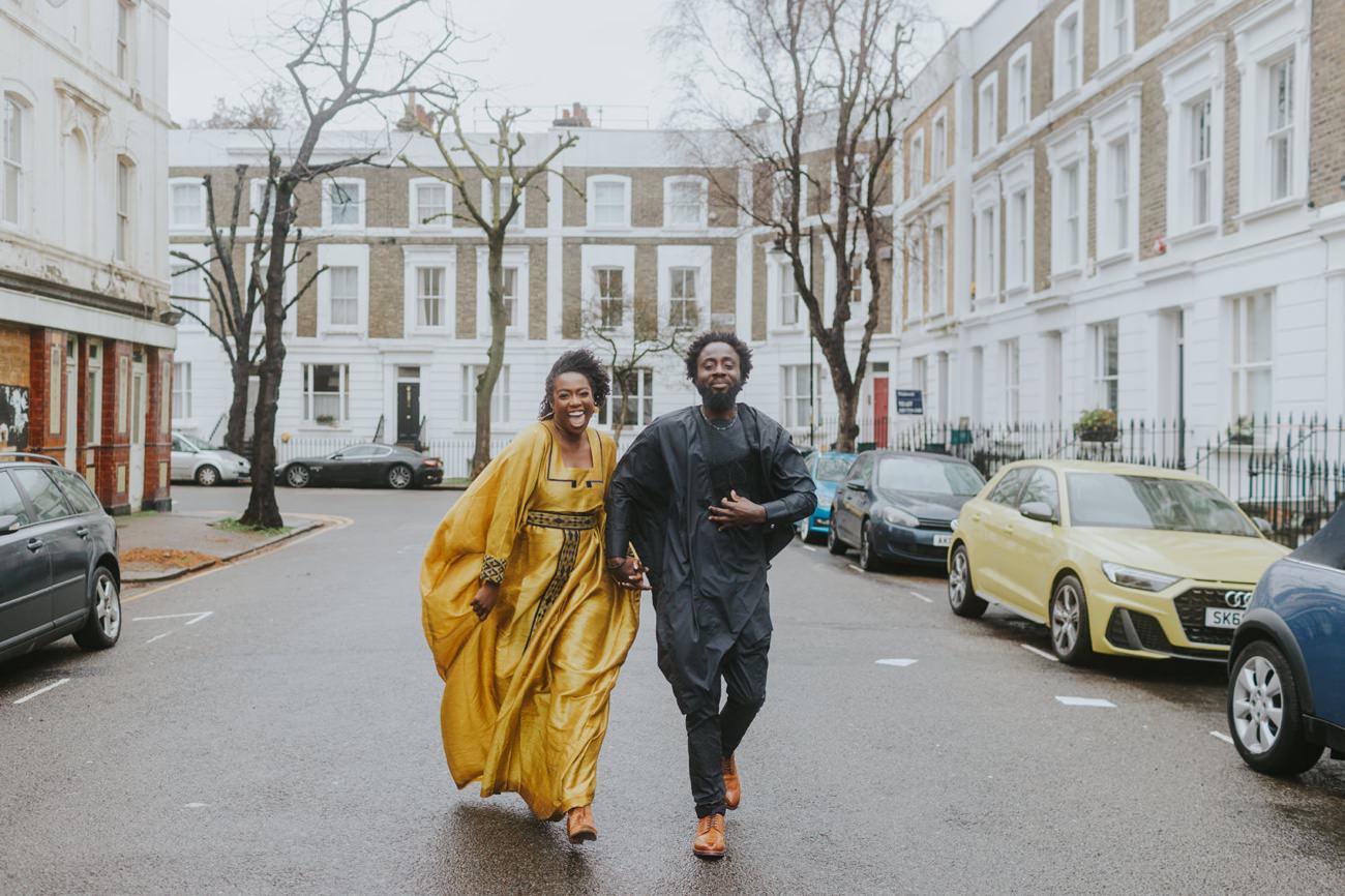 Islington Street wedding photography, couple run through streets of London laughing