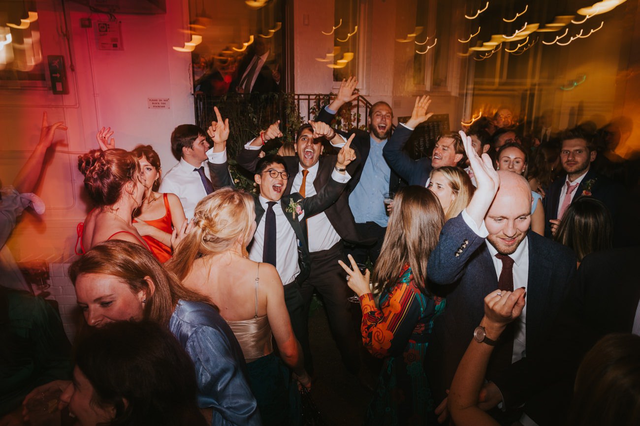 Groom dances with wedding guests