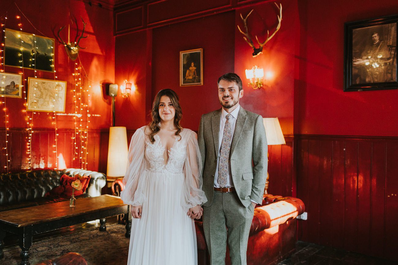 Bride + Groom stand in Red Room, East Dulwich Tavern